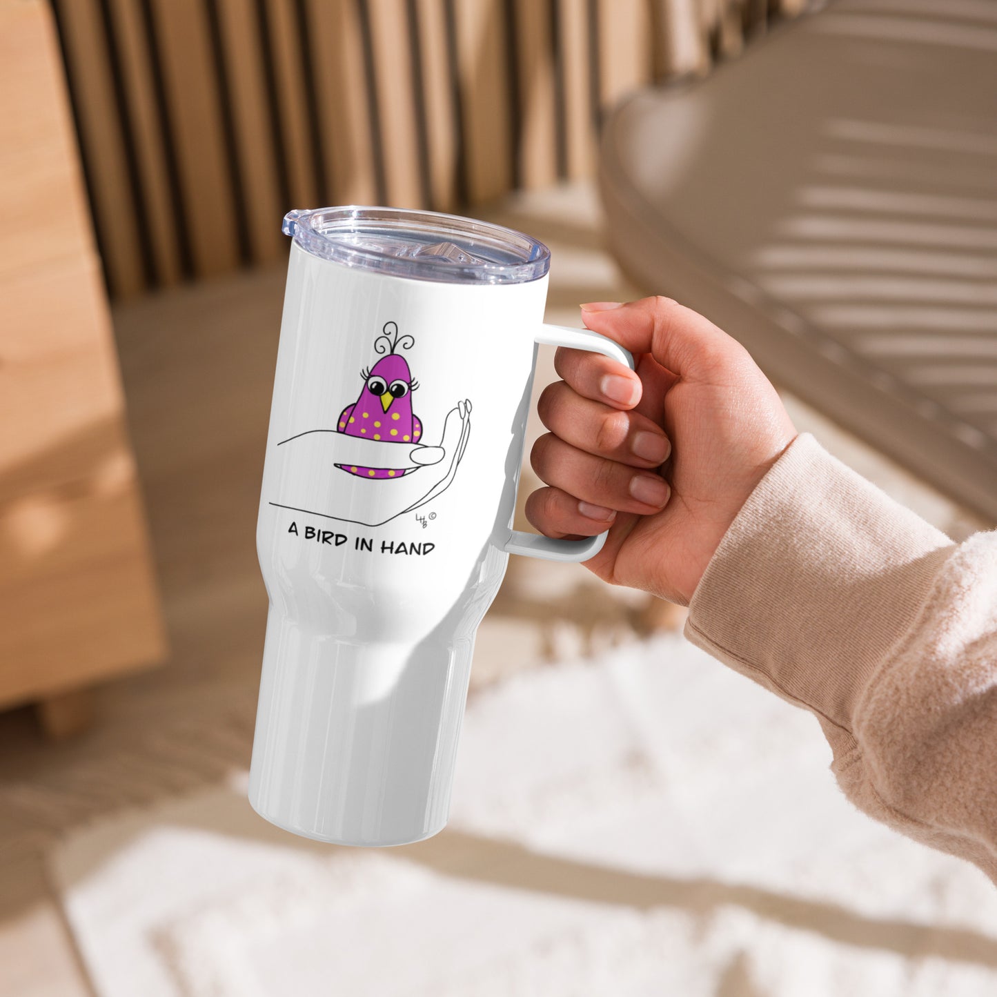 A Bird in Hand Travel mug with a handle from The Quirky Birds Collection