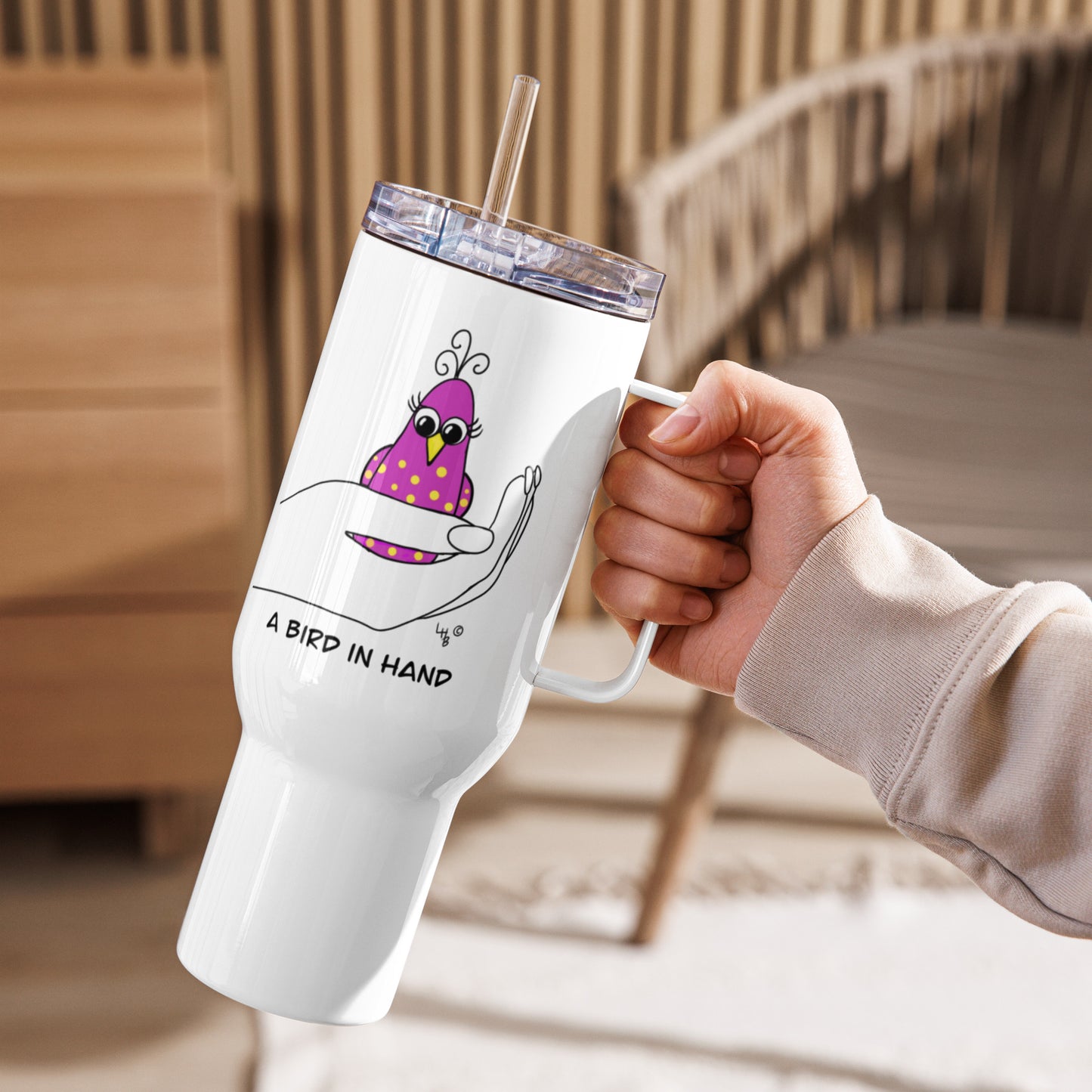 A Bird in Hand Travel mug with a handle from The Quirky Birds Collection