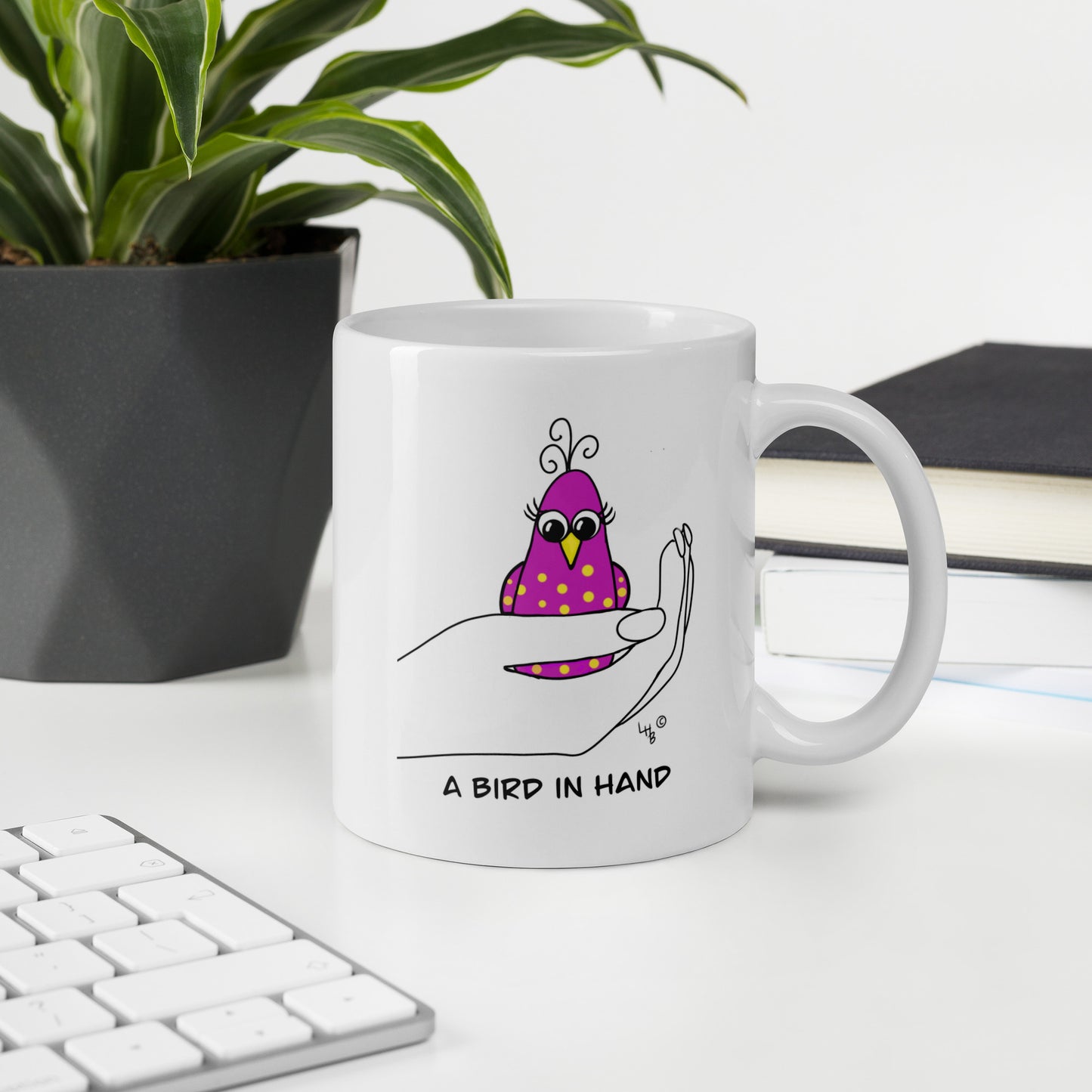 A Bird in Hand White glossy mug from The Quirky Birds Collection