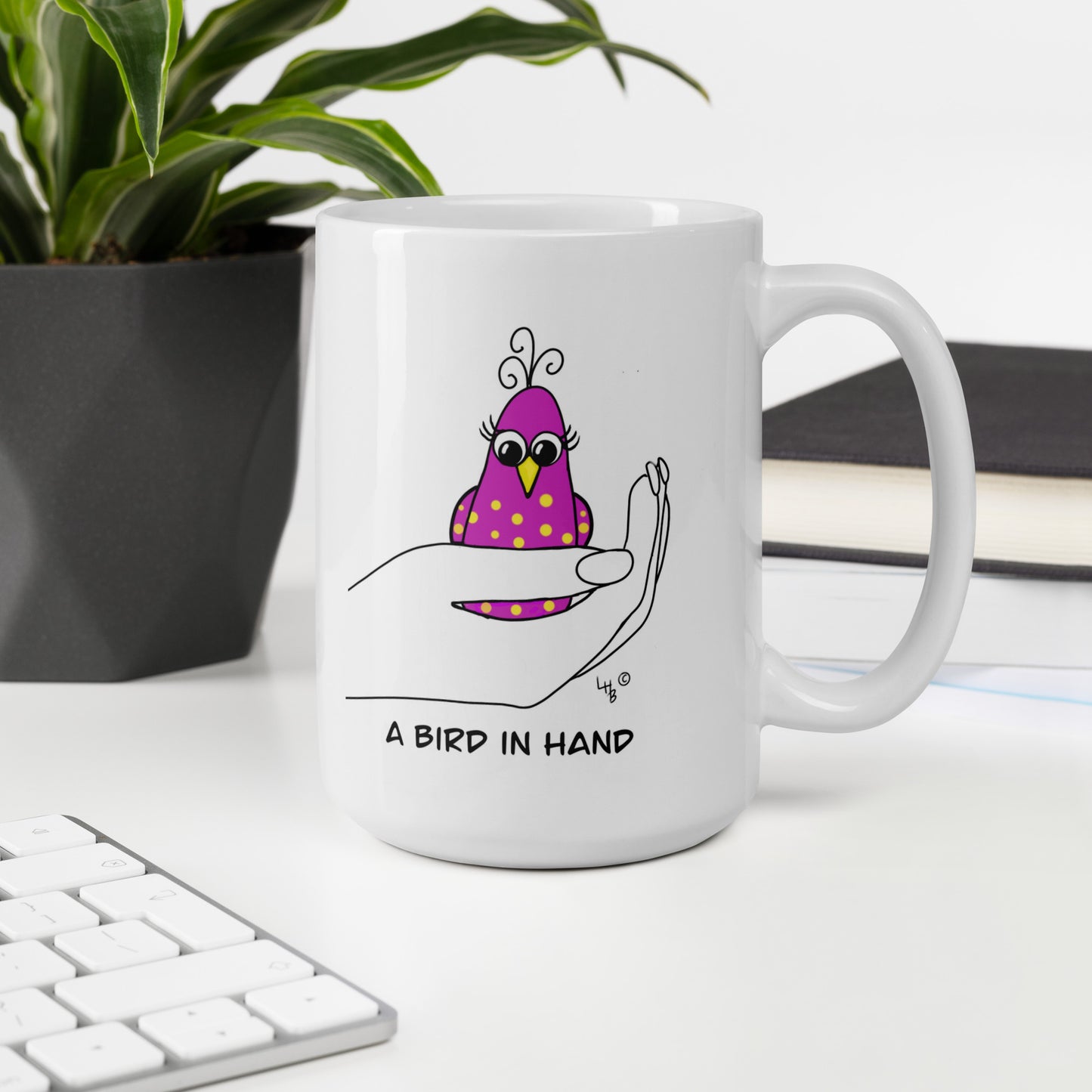 A Bird in Hand White glossy mug from The Quirky Birds Collection