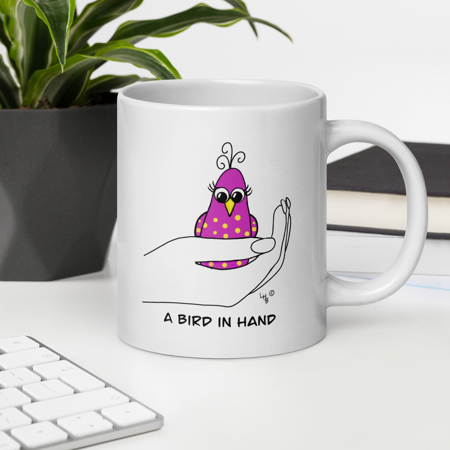 A Bird in Hand White glossy mug from The Quirky Birds Collection